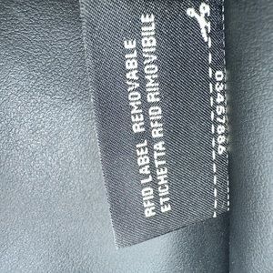 Luxury Fendi Bag, black leather, white straps, flower chain.